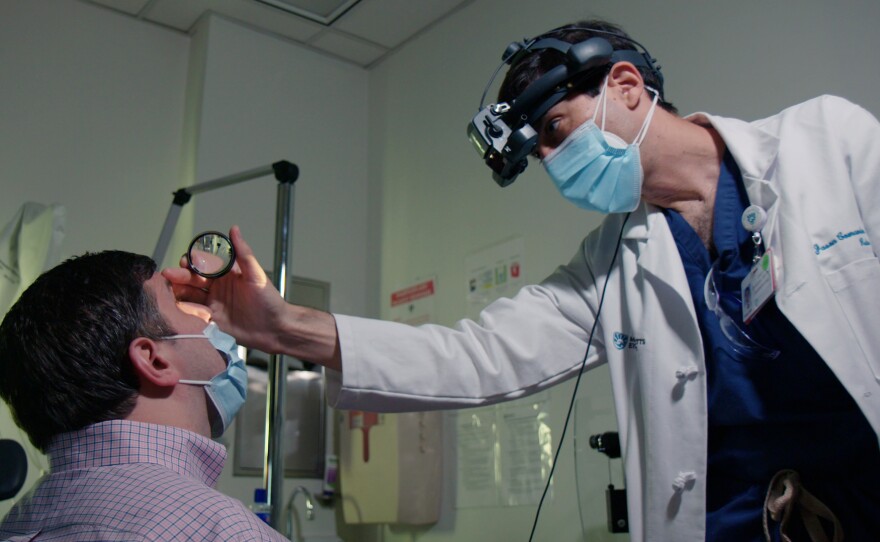 Kalberer visits with Dr. Jason Comander at Mass Eye and Ear in Boston. Doctors are comparing the vision of patients before and after the procedure, and between their treated and untreated eyes, to see if the procedure is helping them see better.