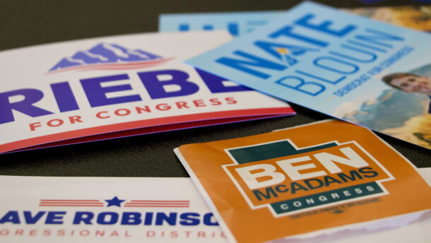 Candidate handouts are displayed at an event for candidates running to represent Utah's new Democratic-leaning congressional district in Taylorsville, Utah on March 21. While some candidates have since dropped out, four remain including former Rep. Ben McAdams and state Sen. Nate Blouin.