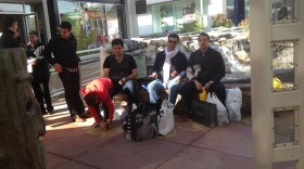 A family of shoppers from Mexico takes a break in San Antonio’s Shops at La Cantera. During high travel times the mall attracts many people from across the border to shop.