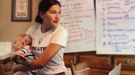 Jewel Hurtado with her son at her kitchen table headquarters in her grandmother's house in Kingsburg in June, 2018. (Courtesy of Elisa Rivera)