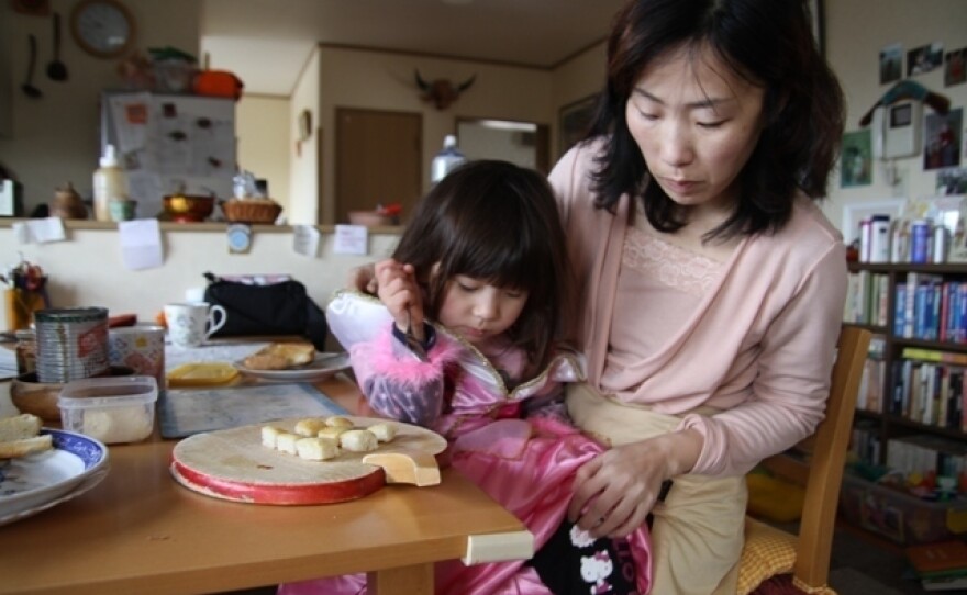 Junko Holland gets her daughter Sophie ready for school in the small town of Aizuwakamatsu. The family is trying to find some normalcy while living uncomfortably close to a quake-damaged nuclear plant.