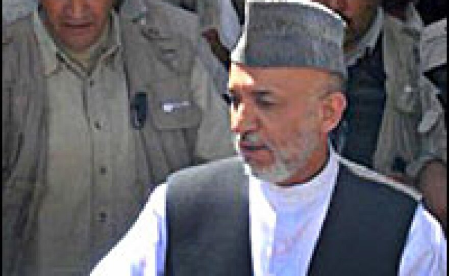 Afghan President Hamid Karzai arrives in the village of Azizabad in Herat province on Thursday. The area was the target of a U.S.-Afghan airstrike on Aug. 22.