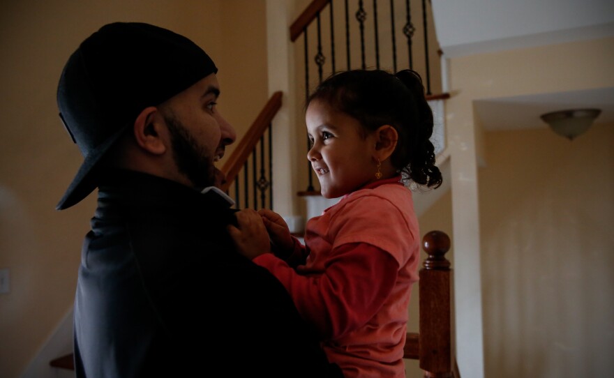 Salah Hadwan and his niece Reema, 3, at home.