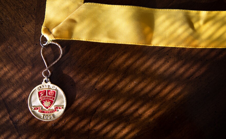 Objects like their son's high school medal, photographed here at their San Diego home, are reminders to Mike and Mimi Murray of the achievement's in their son's past, Aug. 22, 2022.