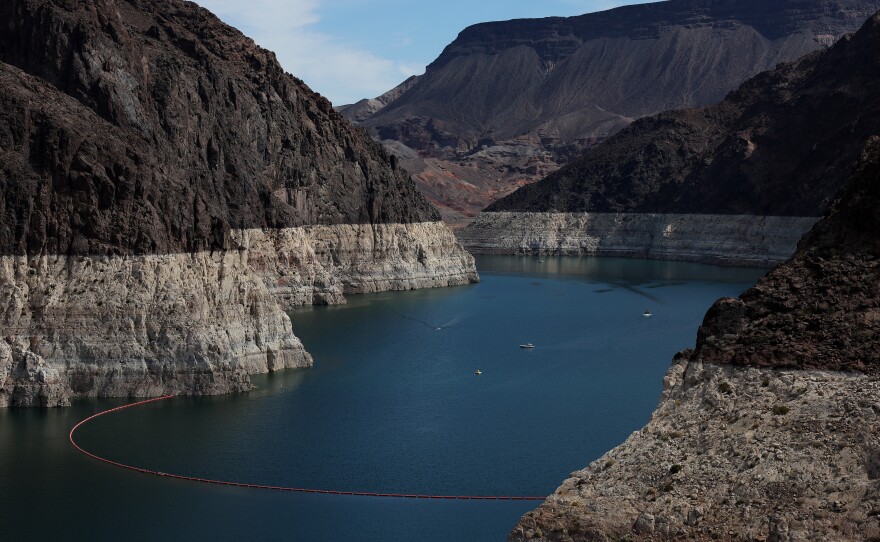 A bleached 'bathtub ring' is visible on the banks of Lake Mead near the Hoover Dam last month. The ring is a stark indicator of how far the water level has fallen in the past two decades or so.