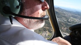 San Diego County Airports Director Peter Drinkwater flies his small prop plane toward a landing at McClellan-Palomar Airport.