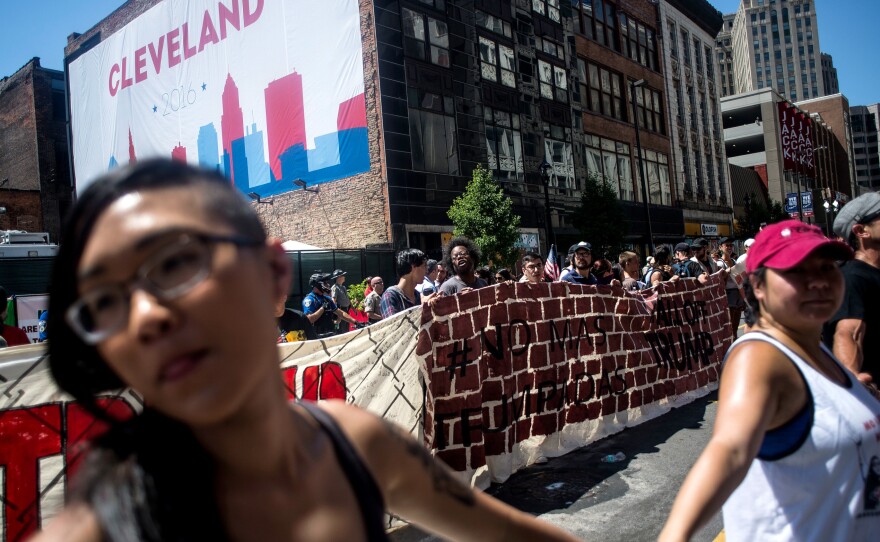 Organizers from Mijente, Georgia Latino Alliance for Human Rights, Ruckus Society and other activist organizations stage a protest and march outside Quicken Loans Arena in Cleveland.