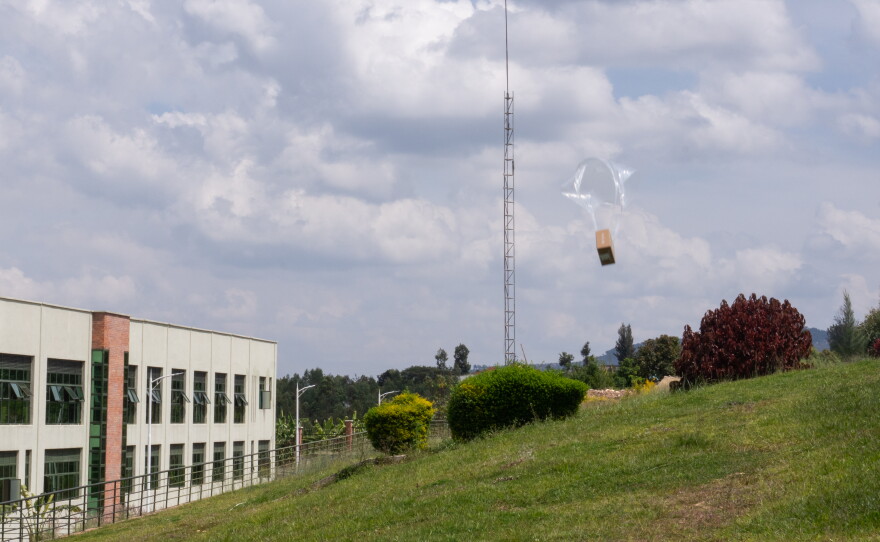 A Zipline drone drops a package filled with medicines at Kabgayi Hospital in Muhanga.