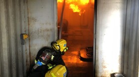 Port of San Diego Harbor Police trainees practice putting out fires in what a ship environment might look like, Oct. 2, 2018.