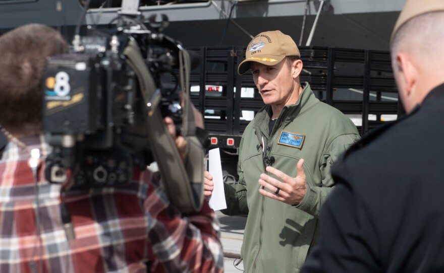 Capt. Brett Crozier, then-commanding officer of the aircraft carrier USS Theodore Roosevelt, talks to reporters in January. The Navy has decided not to restore him to command.