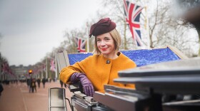 Lucy Worsley in a carriage on The Mall, London.