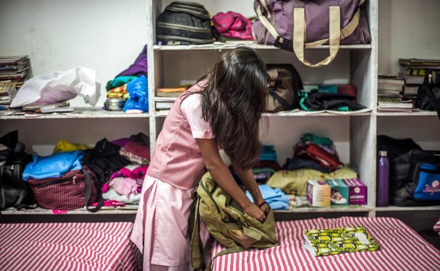 Nimmu, 15, gets ready for class. To stay in school, she needs to pass a national test this March. The problem: "I'm not a great student," she says. Because child marriage is illegal in India, we can't use her full name.