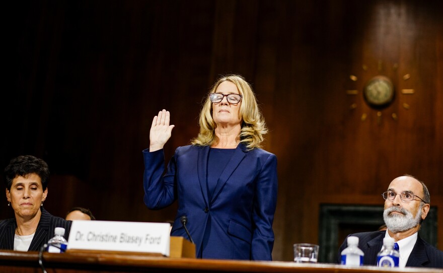 Kavanaugh accuser Christine Blasey Ford is sworn in before testifying Thursday at a confirmation hearing for the Supreme Court nominee.