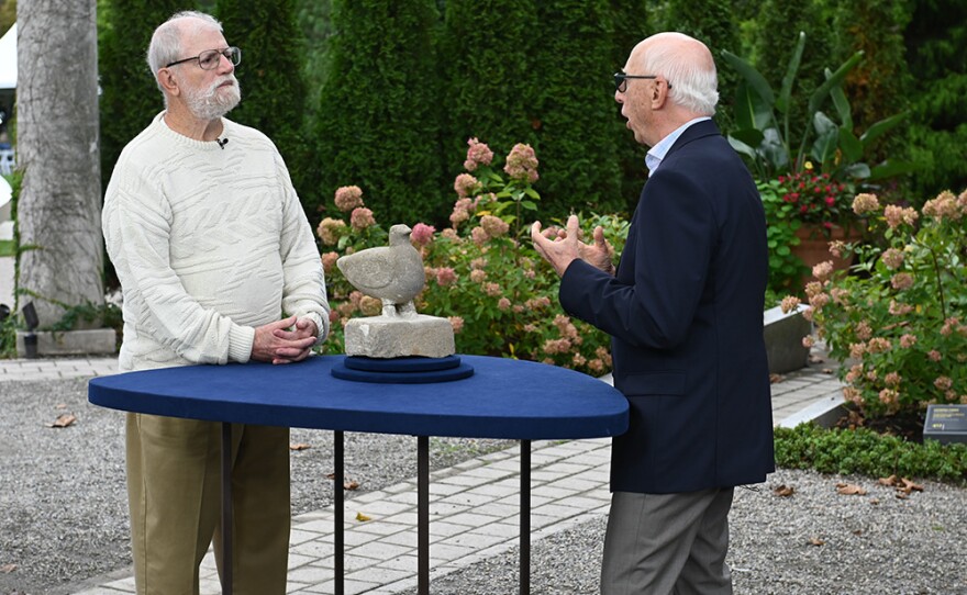 Allan Katz (right) appraises a William Edmondson carved limestone dove, ca. 1940, in Hamilton, N.J. on Oct. 6, 2021. 