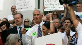Florida Gov. Charlie Crist (center) participates in a rally on the steps of the old Capitol before the start of the special legislative session in Tallahassee on Tuesday. The demonstrators urged lawmakers to allow a constitutional amendment banning offshore oil drilling on the ballot.