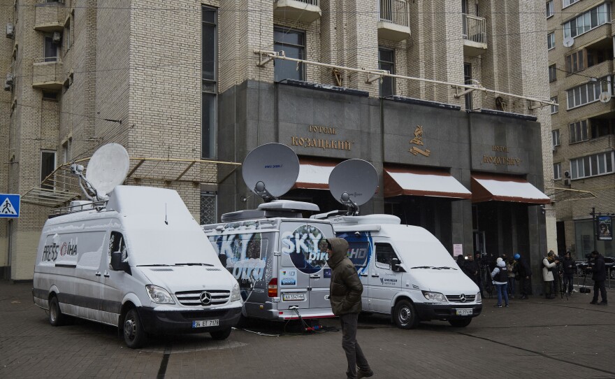 Media broadcasting vans parked in front of a hotel in Maidan Square on March 1 in Kyiv, Ukraine.