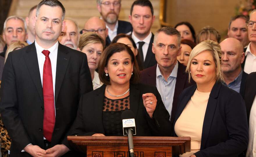 Sinn Fein leader Mary Lou McDonald's party has agreed to a new power-sharing deal with the Democratic Unionist Party. McDonald (center) spoke about the agreement Friday, flanked by deputy leader Michelle O'Neill.