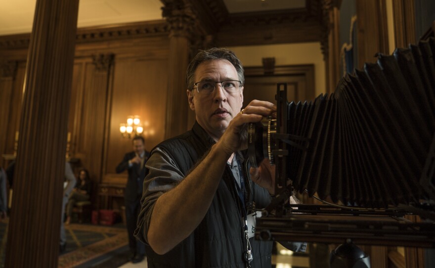 Photographer Greg Miller sets up his camera in the Rayburn Reception Room on Capitol Hill.