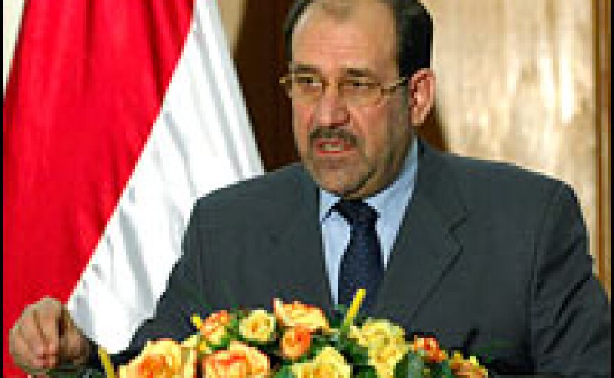 Iraqi Prime Minister Nouri al-Maliki attends a press conference in Baghdad, Dec.  5, 2006.