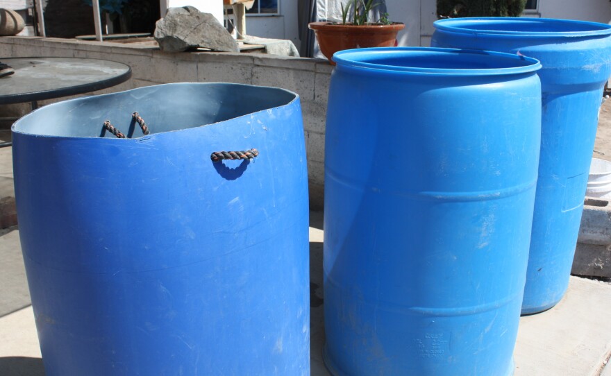 The Colunga family has been carrying water in barrels from neighbors and relatives to use for washing since their well went dry.