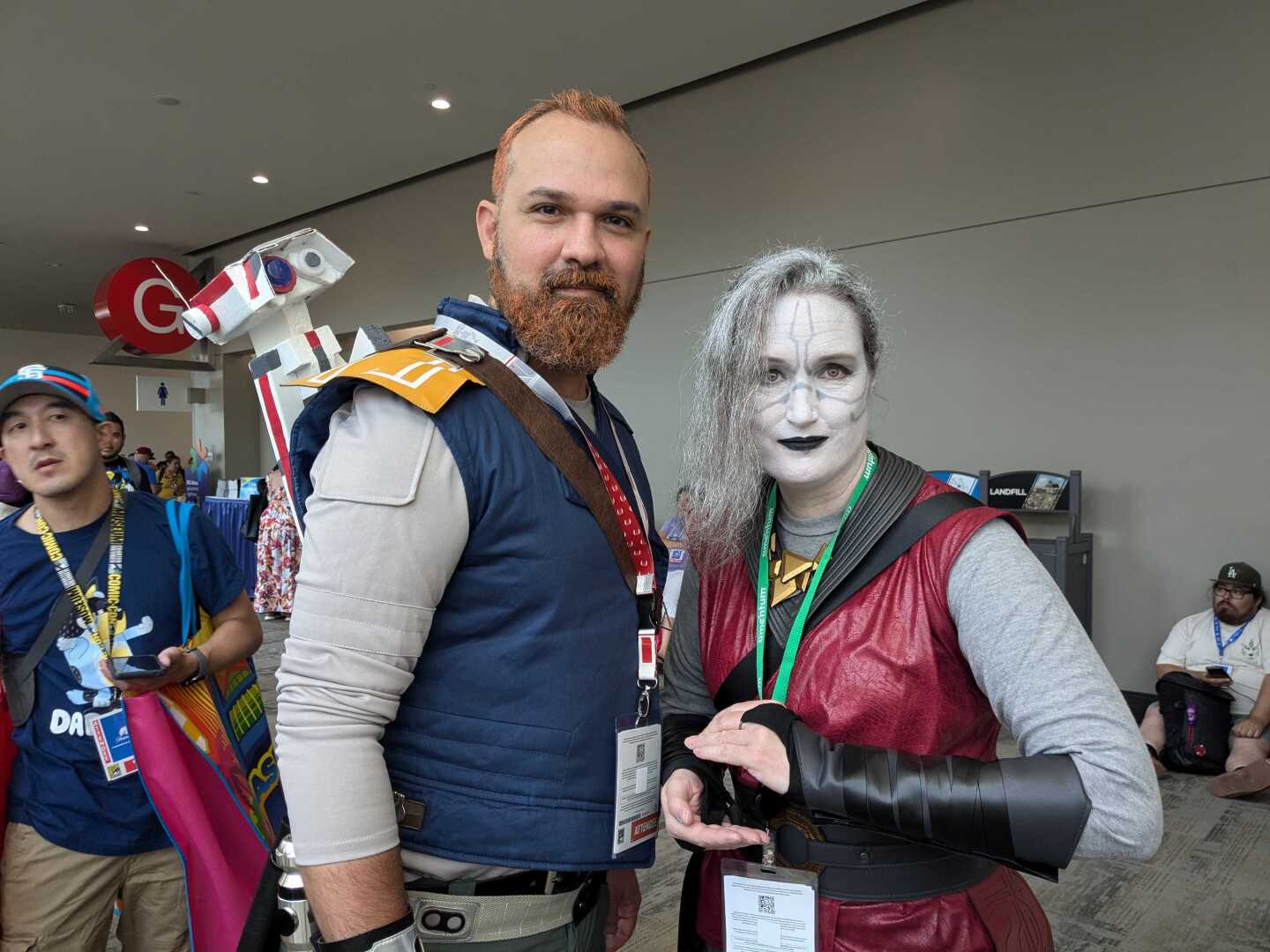 Comic-Con attendees Quinton Sareminouri (left) cosplays as Star Wars character Cal Kestis, while Erica Goode (right) is dressed up as Merrin, another Star Wars character. July 25, 2024. San Diego Convention Center.