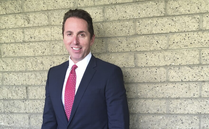 The city council in Los Alamitos, Calif., has given its preliminary approval to a measure exempting the city from a state law that limits cooperation between local police and federal immigration agents. Mayor Troy Edgar is seen here on Monday outside Los Alamitos City Hall.