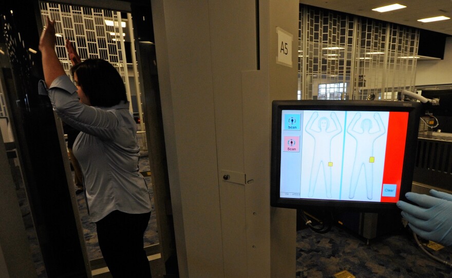 A U.S. Transportation Security Administration employee demonstrates the less intrusive Automated Target Recognition software in 2011.