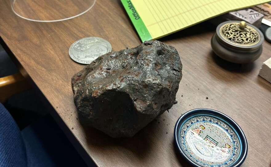 An iron meteorite sits on UC chemistry Professor Mark Thiemens' desk on Aug. 6, 2026.