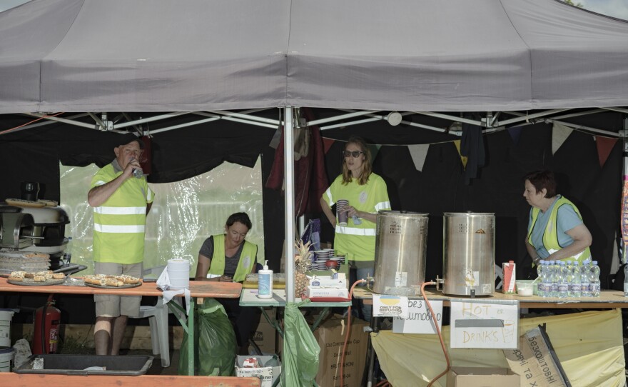 Aid organizations provide food for refugees coming from Ukraine at the border in Medyka, Poland.