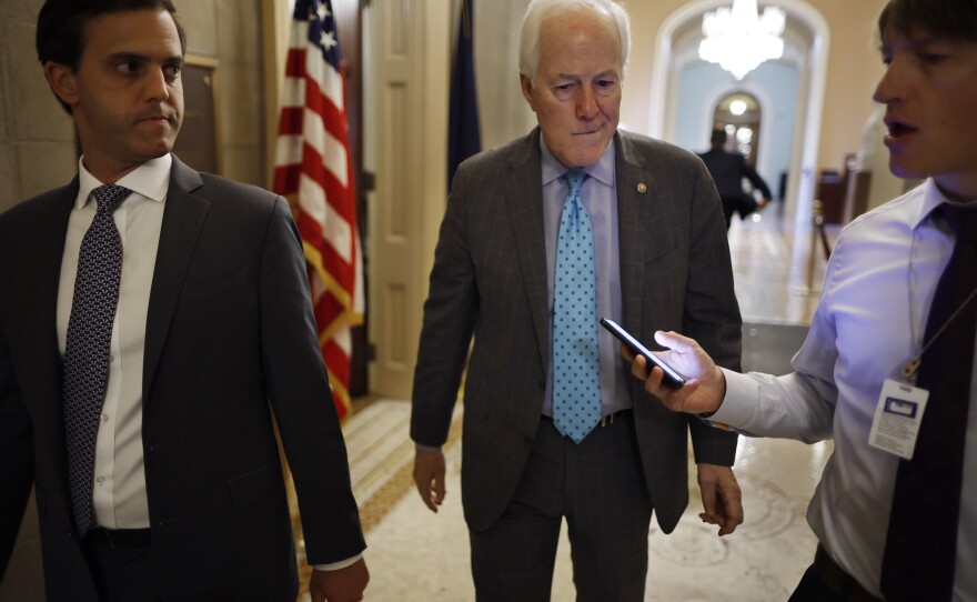 Senate Minority Whip John Cornyn of Texas, the lead Republican negotiator, talks to reporters after giving a speech in support of the Bipartisan Safer Communities Act at the Capitol on Wednesday.