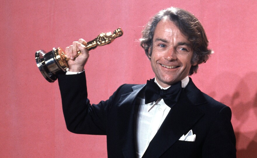 John Avildsen shows off the best director Oscar he won in 1977 for Rocky. Avildsen, who also directed The Karate Kid, died Friday from pancreatic cancer at age 81 in Los Angeles.