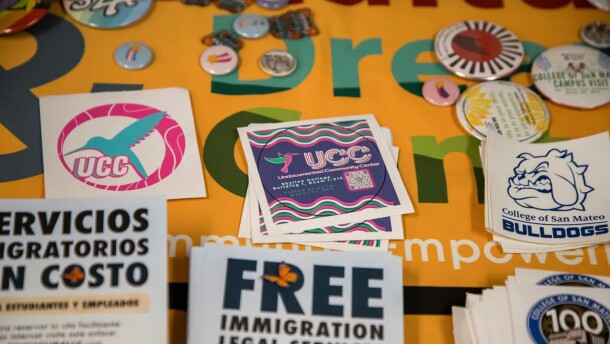 Stickers and flyers on a table in the Undocumented Community Center at the College of San Mateo in San Mateo, on Nov. 28, 2023. At this center, students without legal status can access financial and legal aid as well as guidance in navigating grant applications.