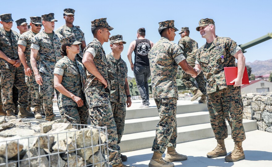 Hardebeck shakes hands with service members after the ceremony. Hardebeck's injuries for which he is being recognized took place in 2010 in Marjah, Afghanistan — one of the most dangerous cities in the country at the time.