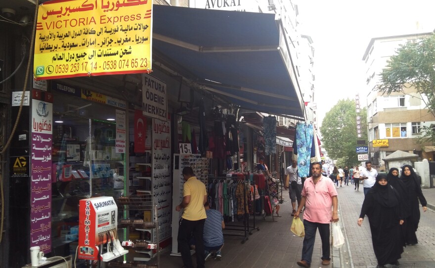 Arabic signs have replaced Turkish ones in Istanbul's Fatih neighborhood, where many Syrian refugees have settled. Turkey has absorbed some 3 million Syrian refugees since the Syrian war began.