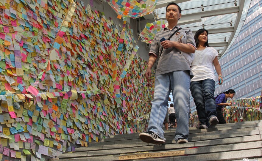 This is Hong Kong's "Lennon Wall," where protesters and supporters have put up thousands of post-it notes expressing their desires for democracy and support for the city. It's based on a similar wall in Prague.