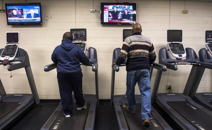 Silvester Fullard (right) says helping his son Tavestsiar get in better shape — through twice a week gym sessions together, and healthier home-cooked meals — has improved his own health.