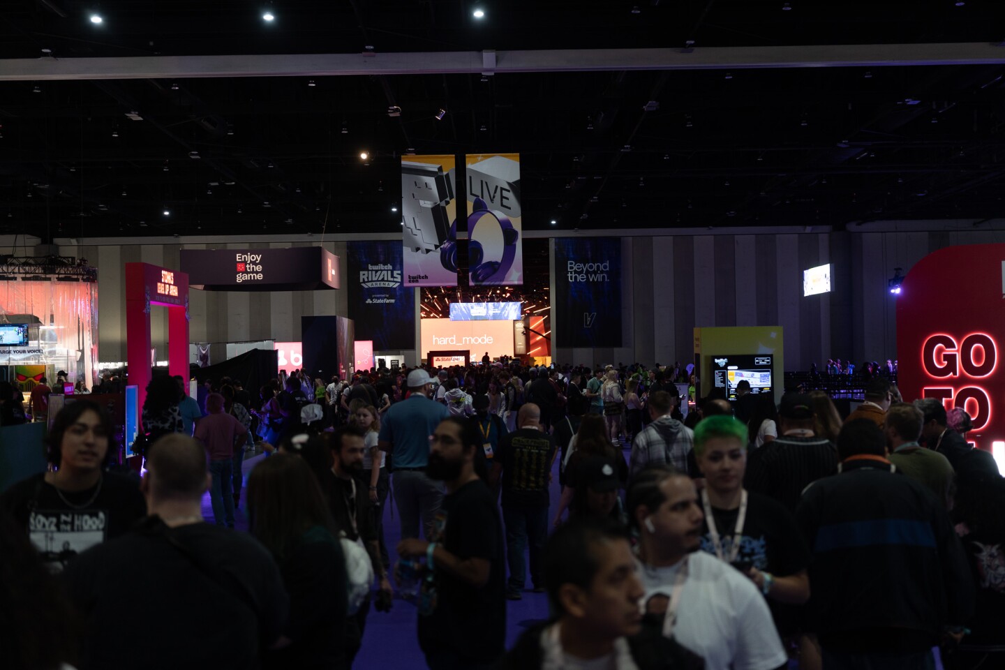 Thousands of TwitchCon attendees meander around the exhibit hall floor at the San Diego Convention Center on Oct. 17, 2025.