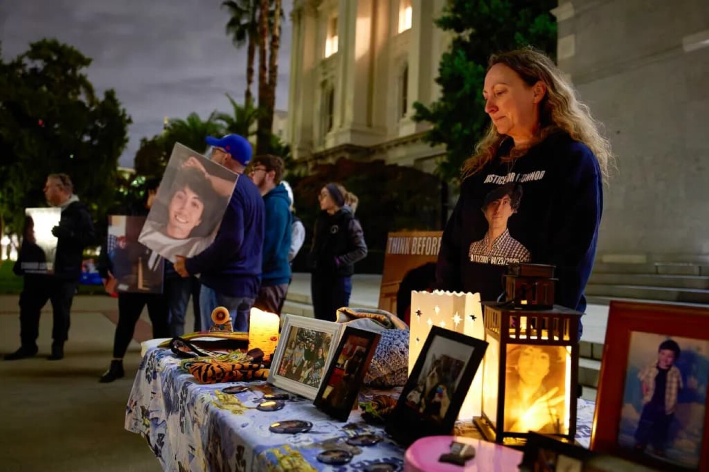 Last: Allison Lyman stands at a table honoring her son Connor, who was killed in a traffic collision, before the start of a candlelight vigil as part of the World Day of Remembrance for Road Traffic Victims at the Capitol in Sacramento on Nov. 16, 2025.