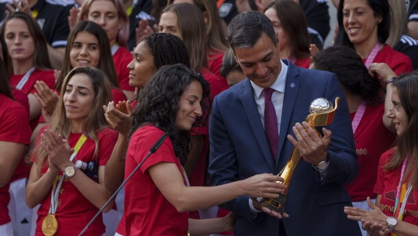 Spain's acting Prime Minister Pedro Sanchez holds the trophy next to Spain's Ivana Andres after their World Cup victory, at La Moncloa Palace in Madrid, Spain, Tuesday, Aug. 22, 2023. Spain beat England in Sydney Sunday to win the Women's World Cup soccer final. 