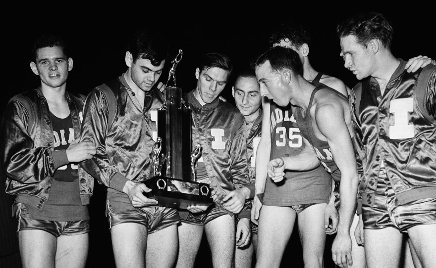 Marvin Huffman, senior guard and captain of the University of Indiana basketball team, (second from left), after winning the tournament on, March 31, 1940, Kansas City, Mo. Huffman was named most valuable player after his team defeated Kansas for the NCAA title.