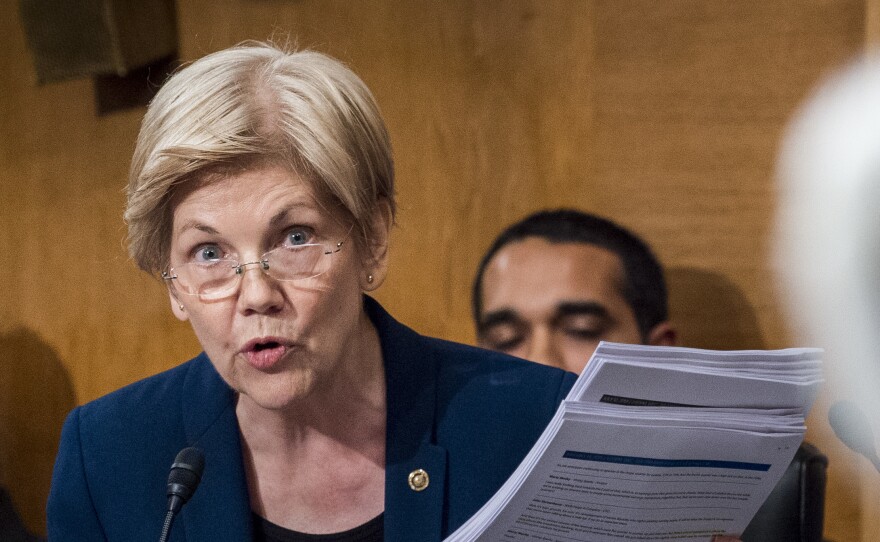 Sen. Elizabeth Warren questions John Stumpf, then CEO of Wells Fargo, during a Senate Banking Committee hearing on Sept. 20.