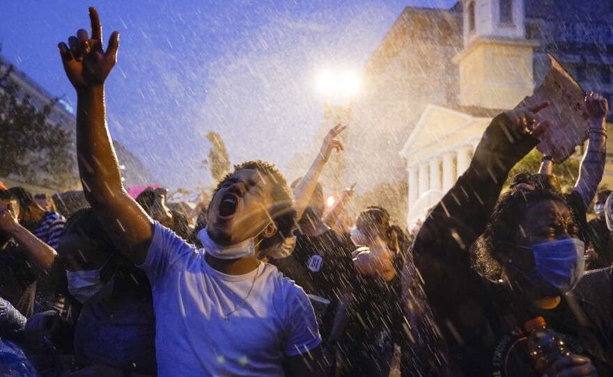 Demonstrators protest police violence near the White House on Thursday.