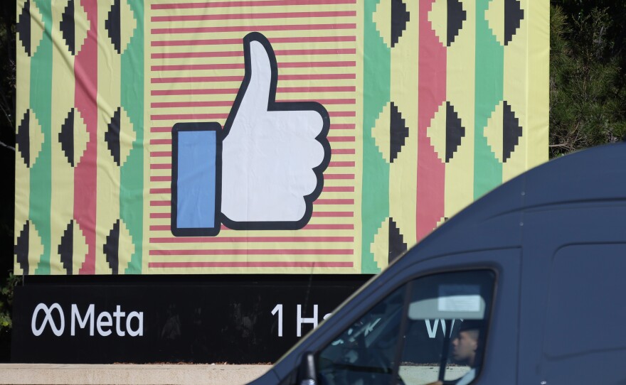 A sign in displayed in front of Meta headquarters in Menlo Park, Calif., on Feb. 2. Meta, Facebook's parent company, reported a 1% decline in revenue in the most recent quarter.