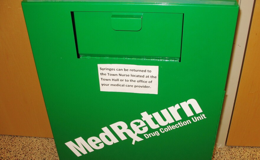 Used needles are deposited in sharps containers like this one at the police station.