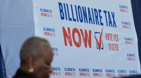 A sign displayed at the Billionaire Tax Now booth at the 2026 California Democratic Party State Convention in San Francisco on Feb. 21, 2026.