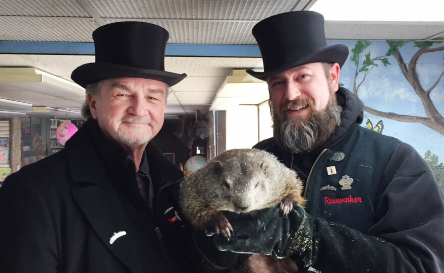 John Griffiths and A.J. Dereume, members of Punxsutawney Phil's "Inner Circle," hold the famous groundhog.