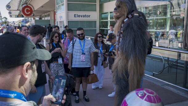 A cosplayer greets fans in a full Chewbacca suit at Comic-Con on July 25, 2025.