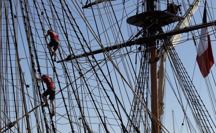 Sailors climb in the three masts of the 213-foot-long frigate Hermione during preparations to sail across the Atlantic, in La Rochelle, southwestern France.