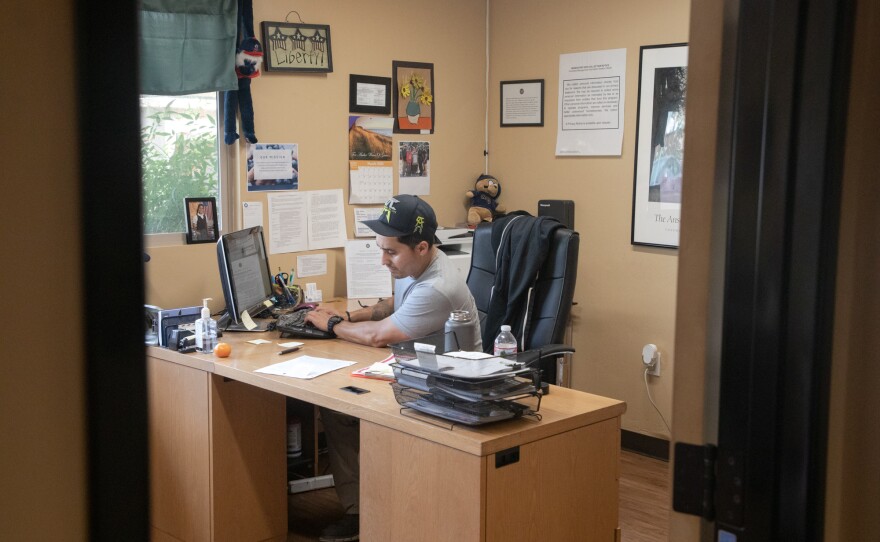 Anthony Hernandez, the operations and receiving manager at Operation HOPE in Vista, works in his office on March 21, 2020.