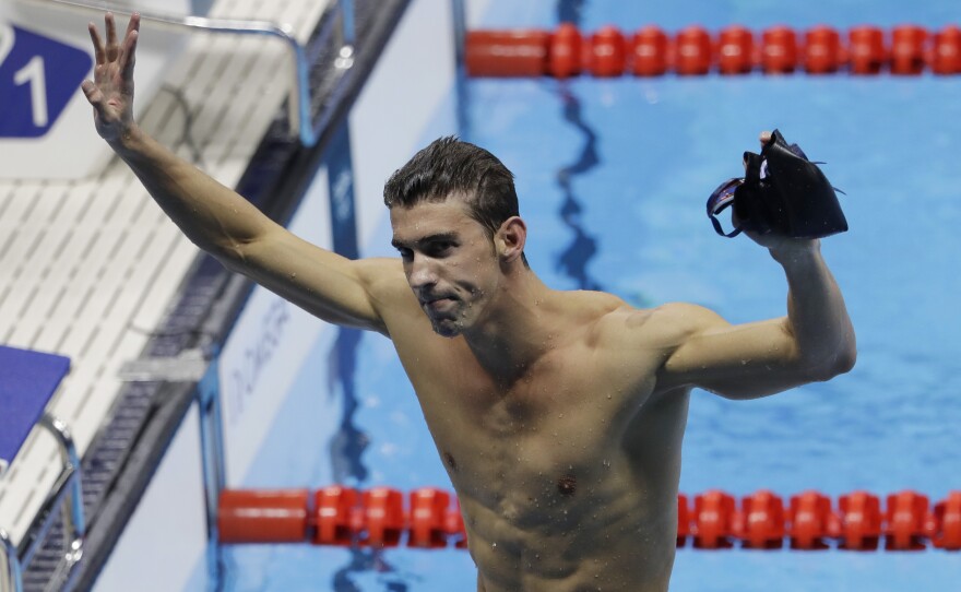 Michael Phelps celebrates winning the gold medal Thursday in the men's 200-meter individual medley. It's was his fourth gold in Rio and the 22nd in his Olympic career.